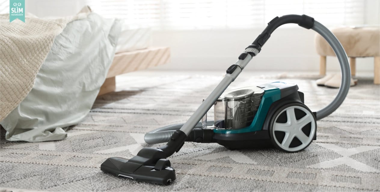 Stofzuiger op een vloerkleed in een  slaapkamer